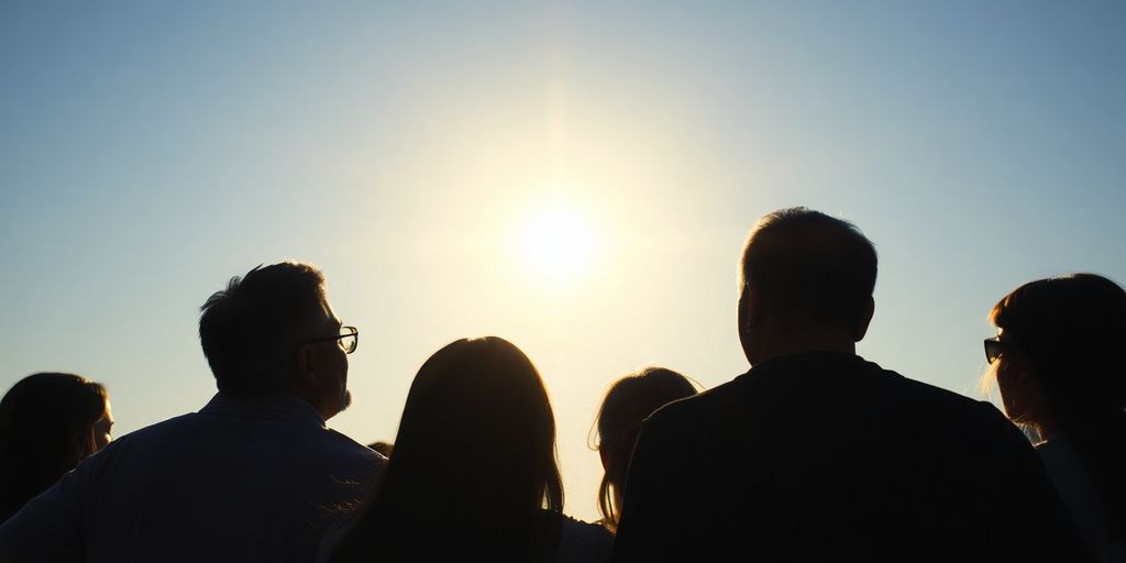 Team members looking at a bright, distant light.
